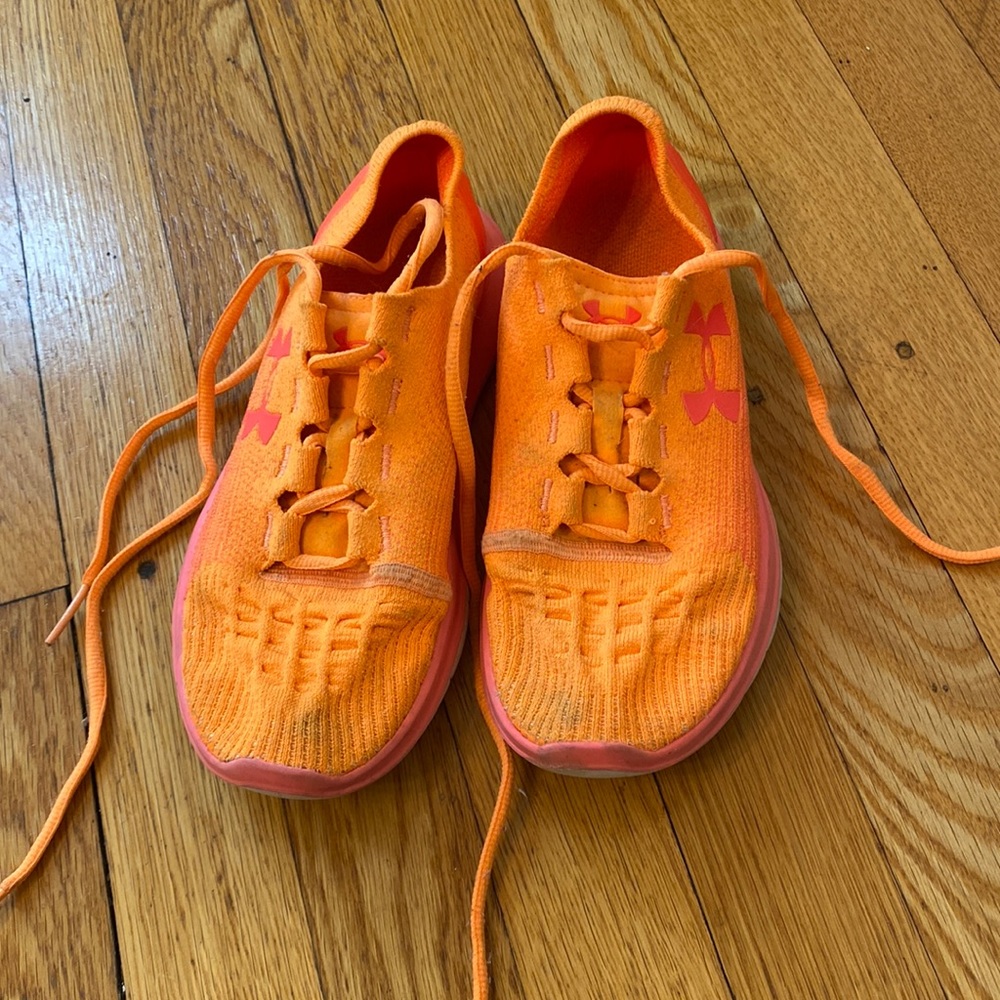 Orange Under Armour running shoes